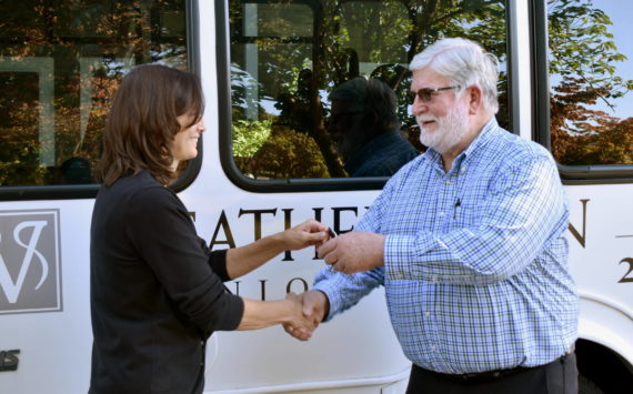 Andrea Peterson officially hands the keys to a new van to Mac Hoover of Christ’s Church in Federal Way. Alex Bruell/Sound Publishing