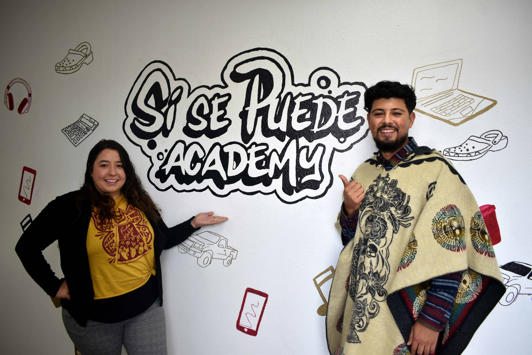 Photo by Alex Bruell/the Mirror
Sí se Puede Program Manager Elsa Alvarado and student support advocate Emmanuel Lopez pose for a picture by the entrance of the program’s new home near where 16th Avenue South meets Highway 99 in Federal Way. Sí se Puede is operated by El Centro de la Raza and aims to help young people get their GED and on track toward meaningful careers.