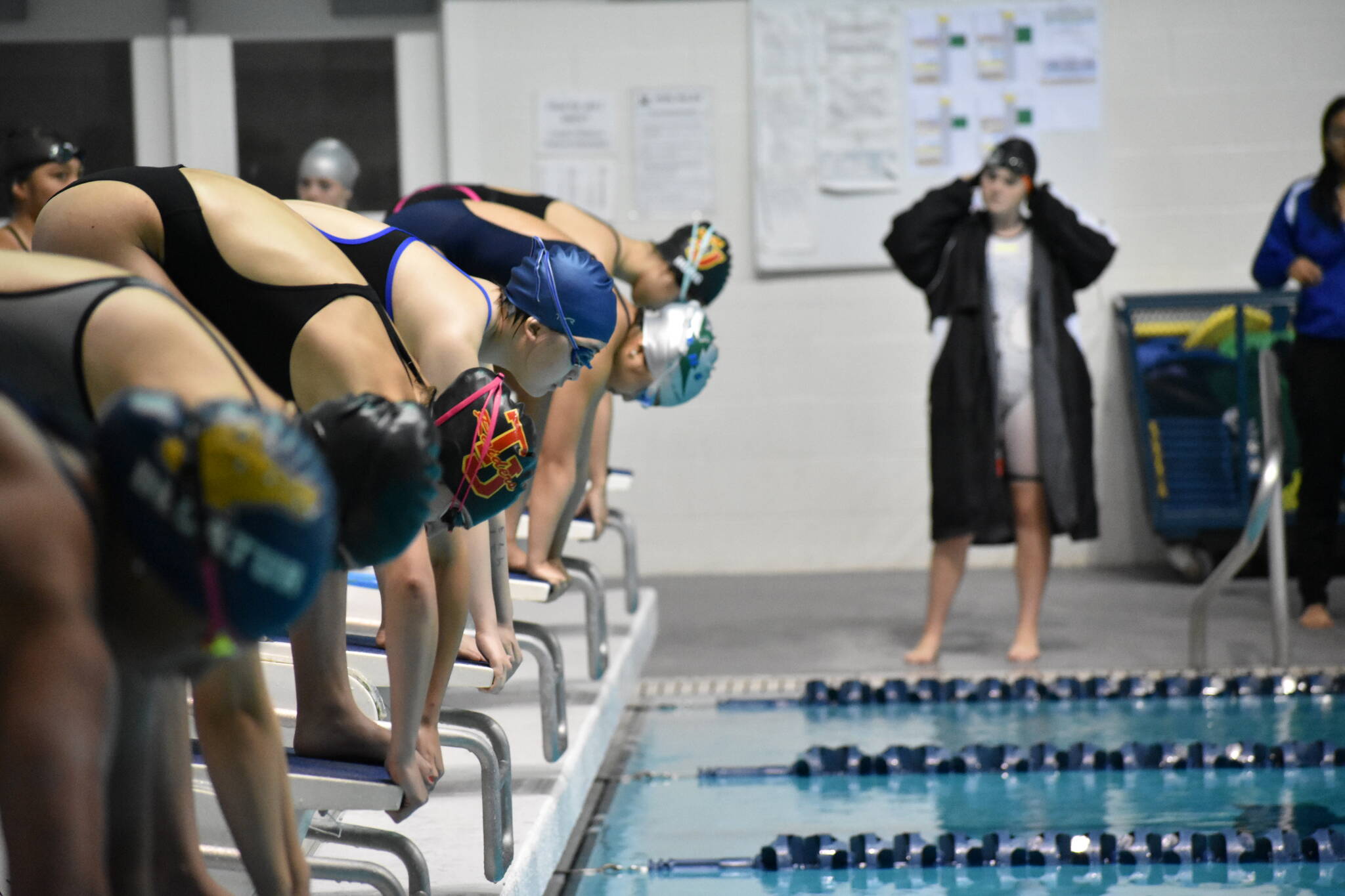 Swimmers line up for the 400 Yard Freestyle Relay at the All City Meet in October 2022 inside the King County Aquatic Center. Photo by Ben Ray/Sound Publishing