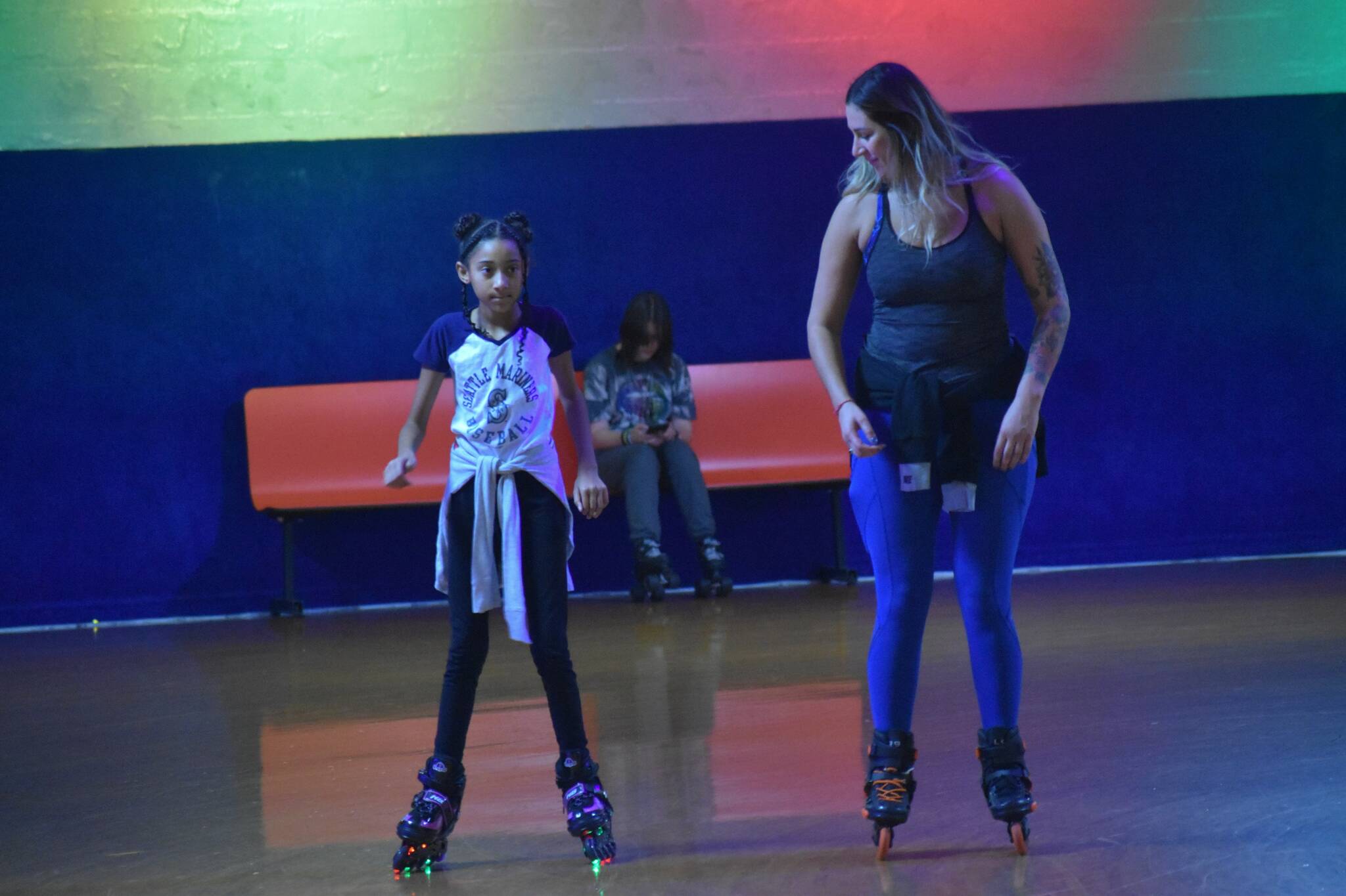 Skaters bust some moves or grab a bite to eat Saturday afternoon at the public re-opening of Federal Way’s iconic roller rink, now owned and operated by El Centro de La Raza. Photos by Alex Bruell/the Mirror