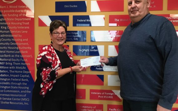 Courtesy photo
The Mirror’s Cindy Ducich delivers a donation check to Alan Clapper, William J. Wood Veterans House services coordinator.