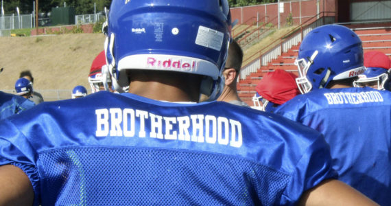 The Federal Way High School football team wears practice jerseys with the word “brotherhood” on the back to honor former teammate Allen Harris. Photo by Olivia Sullivan, the Mirror