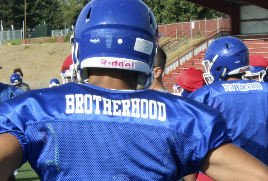 <p>The Federal Way High School football team wears practice jerseys with the word “brotherhood” on the back to honor former teammate Allen Harris. Photo by Olivia Sullivan, the Mirror</p>