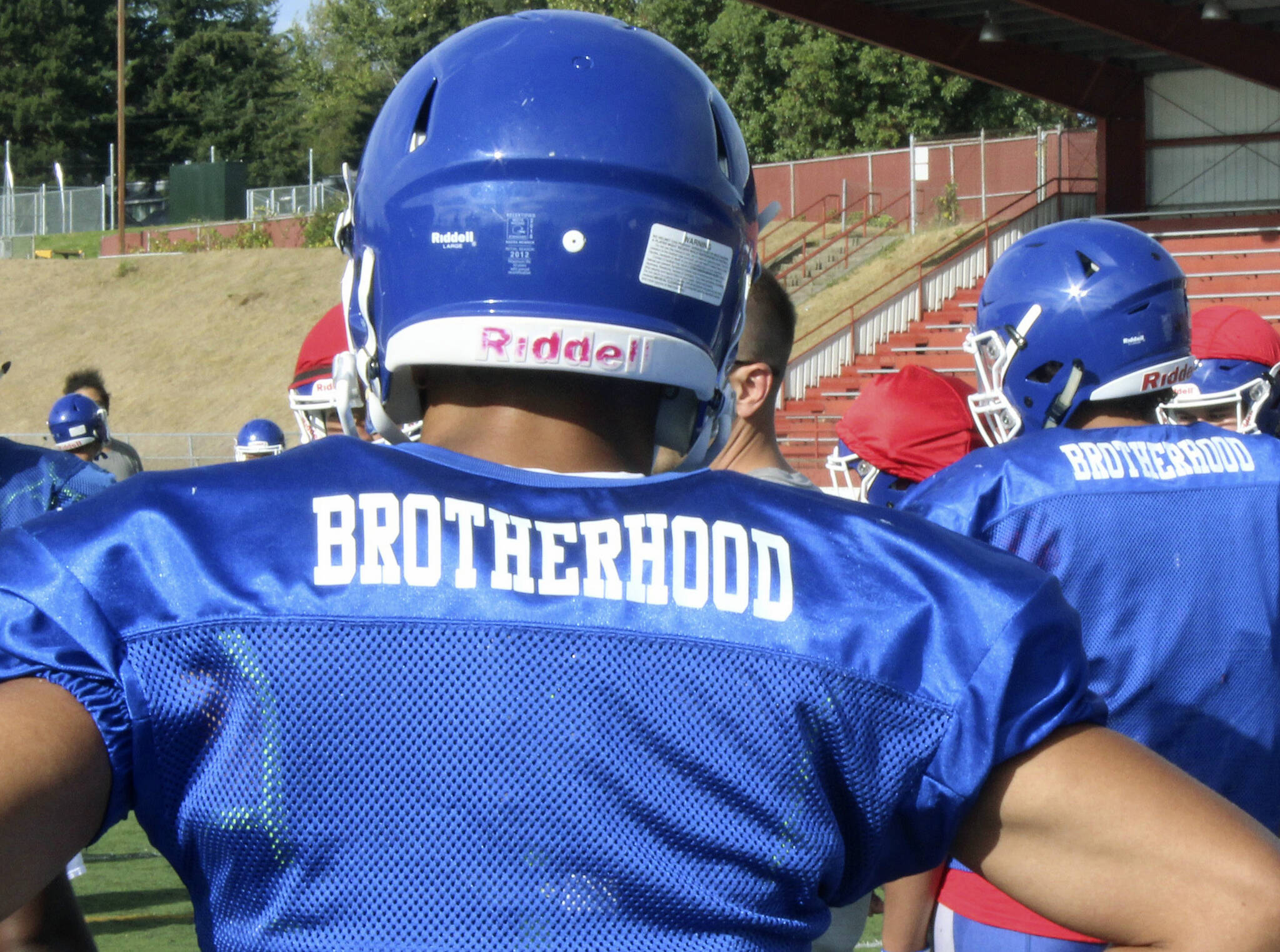 The Federal Way High School football team wears practice jerseys with the word “brotherhood” on the back to honor former teammate Allen Harris. Photo by Olivia Sullivan, the Mirror