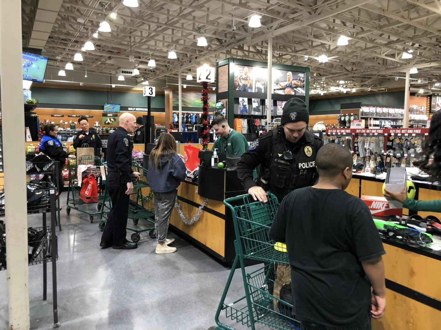 Local kids shop with a cop at Dick’s Sporting Goods Federal Way Mirror