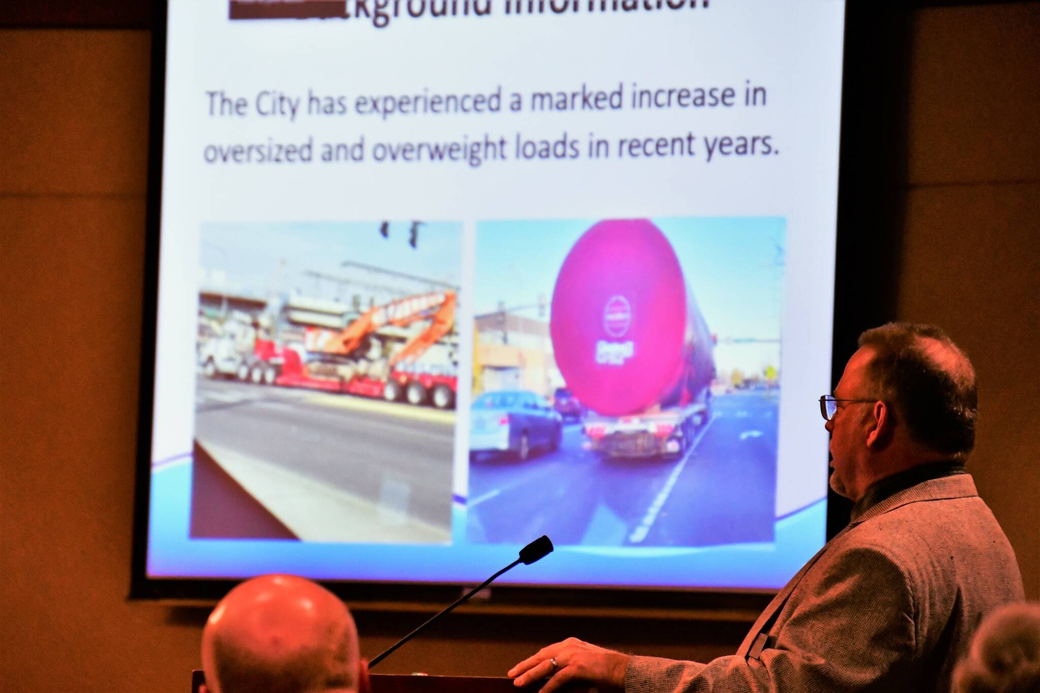 Public Works Development Services Manager Cole Elliott gives a presentation on the increase of oversize- and overweight-loaded vehicles in Federal Way in recent years, many of those vehicles travelling on non-designated truck routes which increases wear-and-tear of city infrastructure. An ordinance in the works would seek to work cooperatively with haulers to minimize that damage. Photo by Bruce Honda