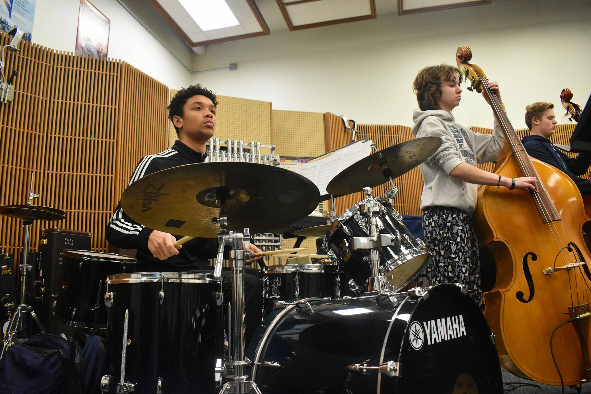 The drummer and bassists in Jeff Chang’s early-morning jazz band practice the morning of Jan. 18. Alex Bruell / The Mirror