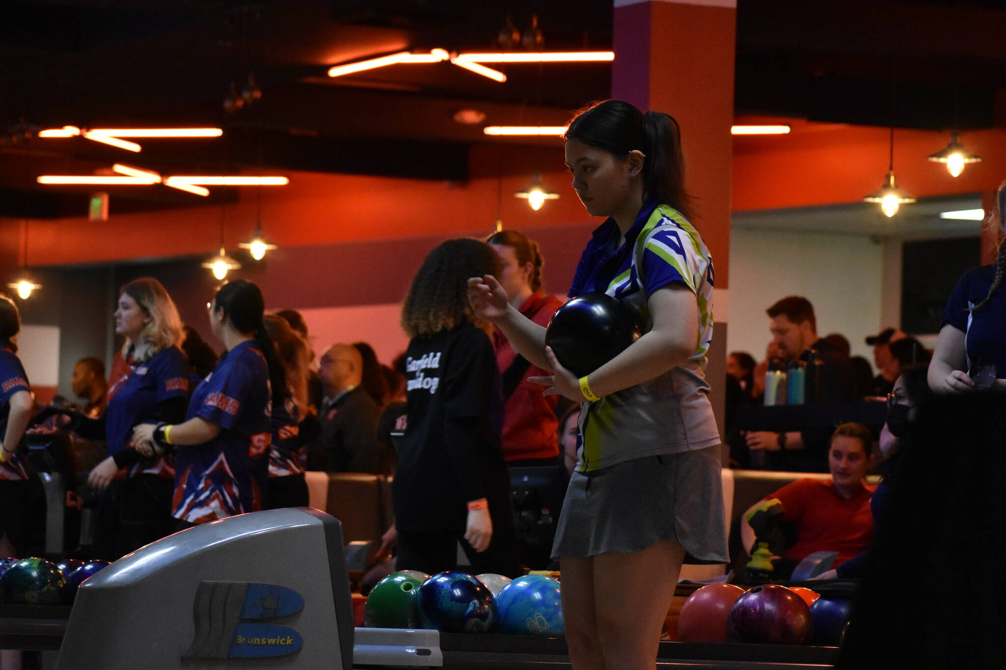 Todd Beamer senior Jazel Tuquia gages in before her next bowl at the state tournament.
