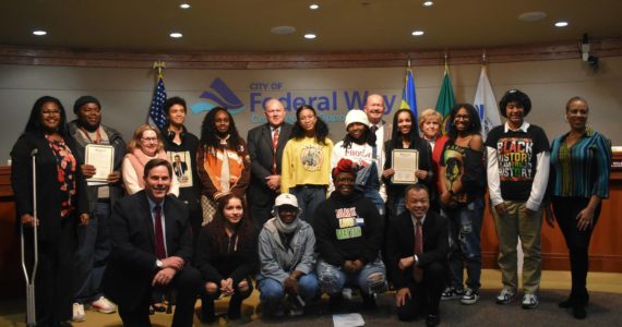 Federal Way councilmembers and the mayor pose for a photo with students from Thomas Jefferson and Decatur high schools during the city’s proclamation of Black History Month. Alex Bruell / The Mirror