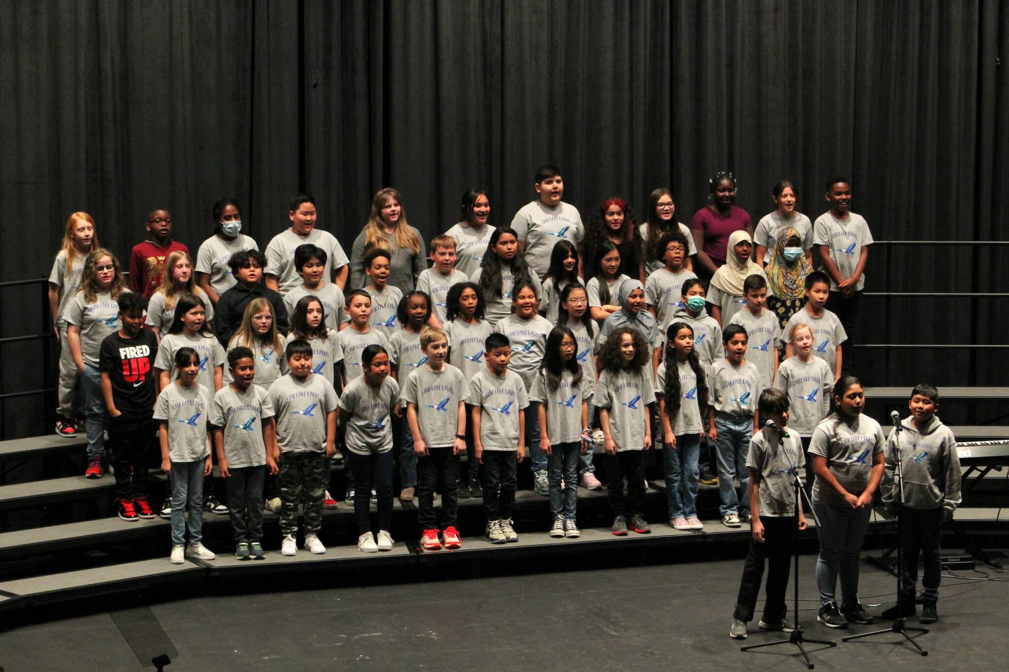 The Star Lake Elementary School choir performed “One Love” prior to Ferrell’s speech Thursday. Alex Bruell / The Mirror