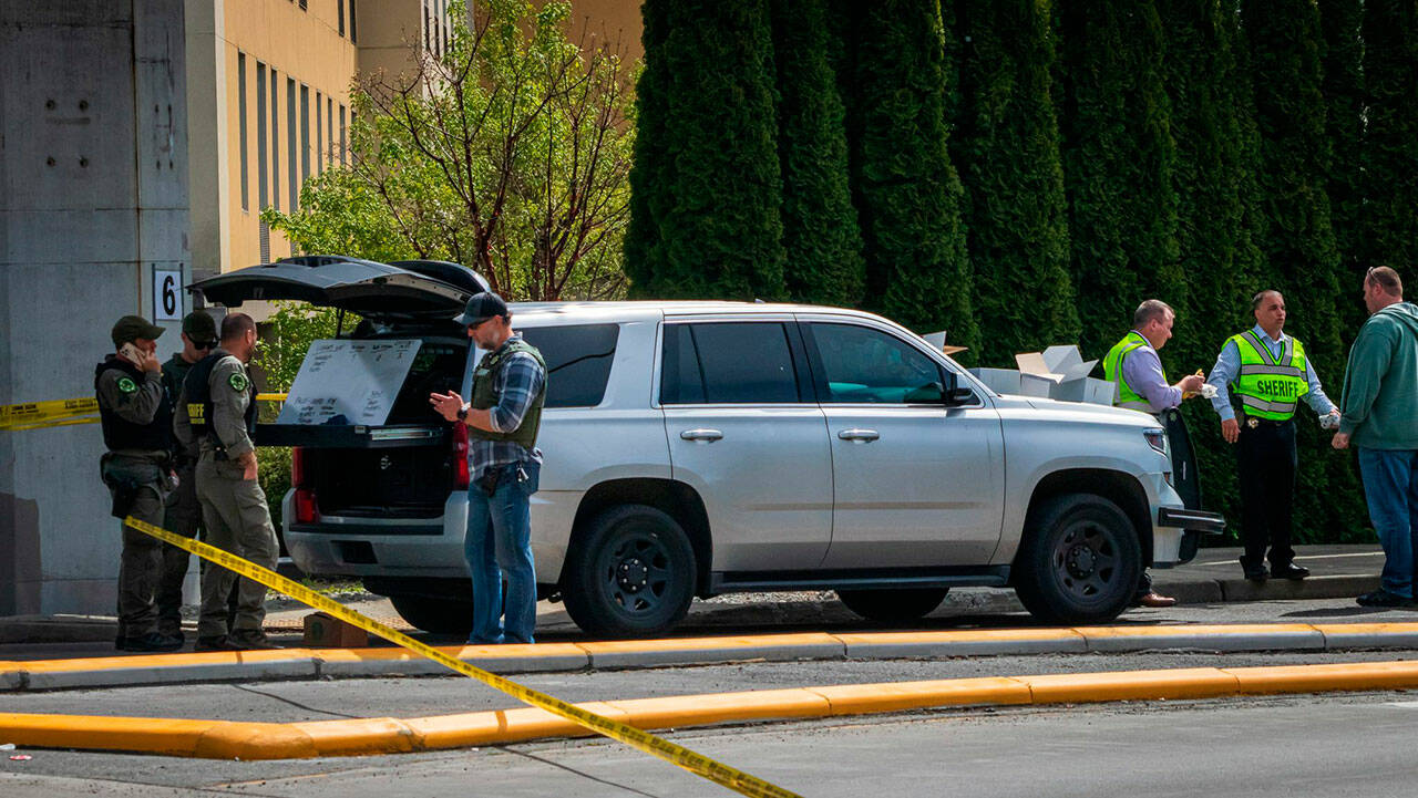 Law enforcement officials investigate the scene of a fatal shooting near a freeway ramp in Federal Way on May 4, 2022. (File photo courtesy of South Sound News)