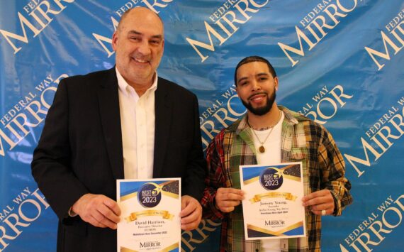 David Harrison, left, and Jamony Young hold their Hometown Hero of the Year awards on March 8. Alex Bruell / The Mirror