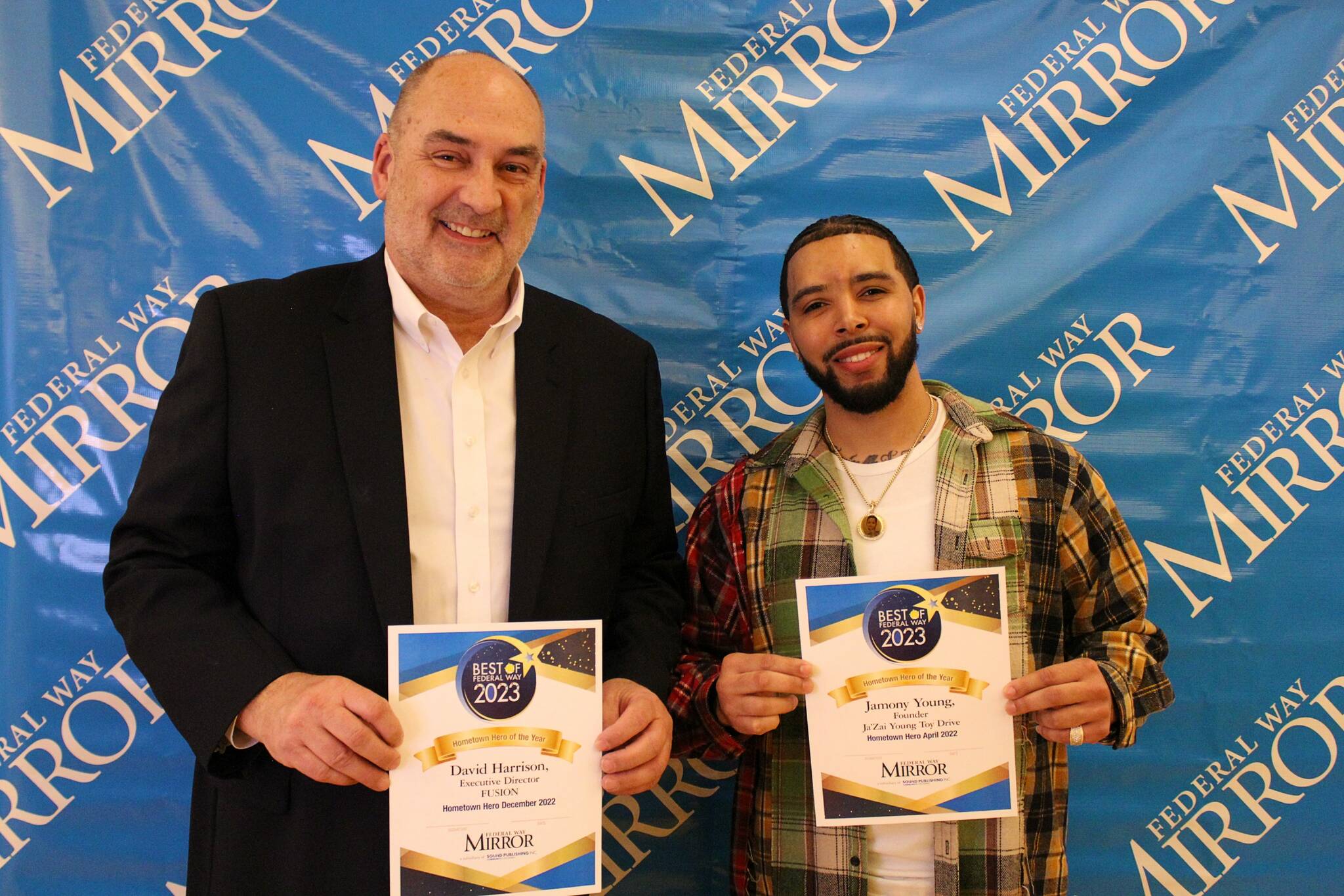David Harrison, left, and Jamony Young hold their Hometown Hero of the Year awards on March 8. Alex Bruell / The Mirror
