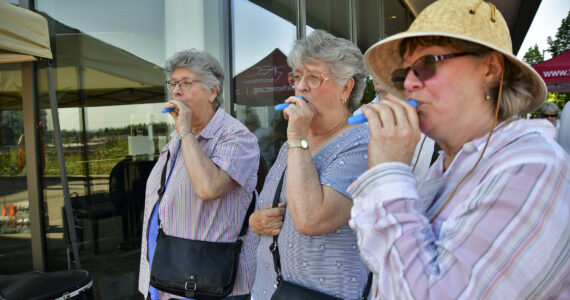Attendees of the June 21, 2021, Make Music Federal Way event play kazoos outside of the Federal Way Performing Arts and Event Center. Photo courtesy of Bruce Honda