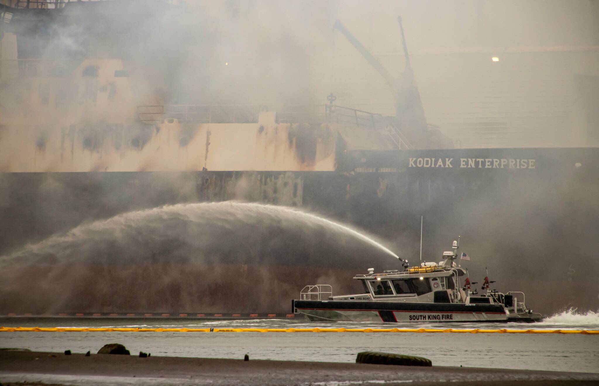 A vessel in Tacoma caught fire early on April 8 and continues to smolder as of April 10. Several local fire agencies, including South King Fire and Rescue, responded to assist with the incident. Photo courtesy of South Sound Media