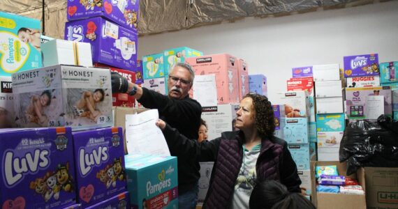 Volunteers move boxes of diapers at Do The Right Thing’s annual diaper drive Wednesday morning.