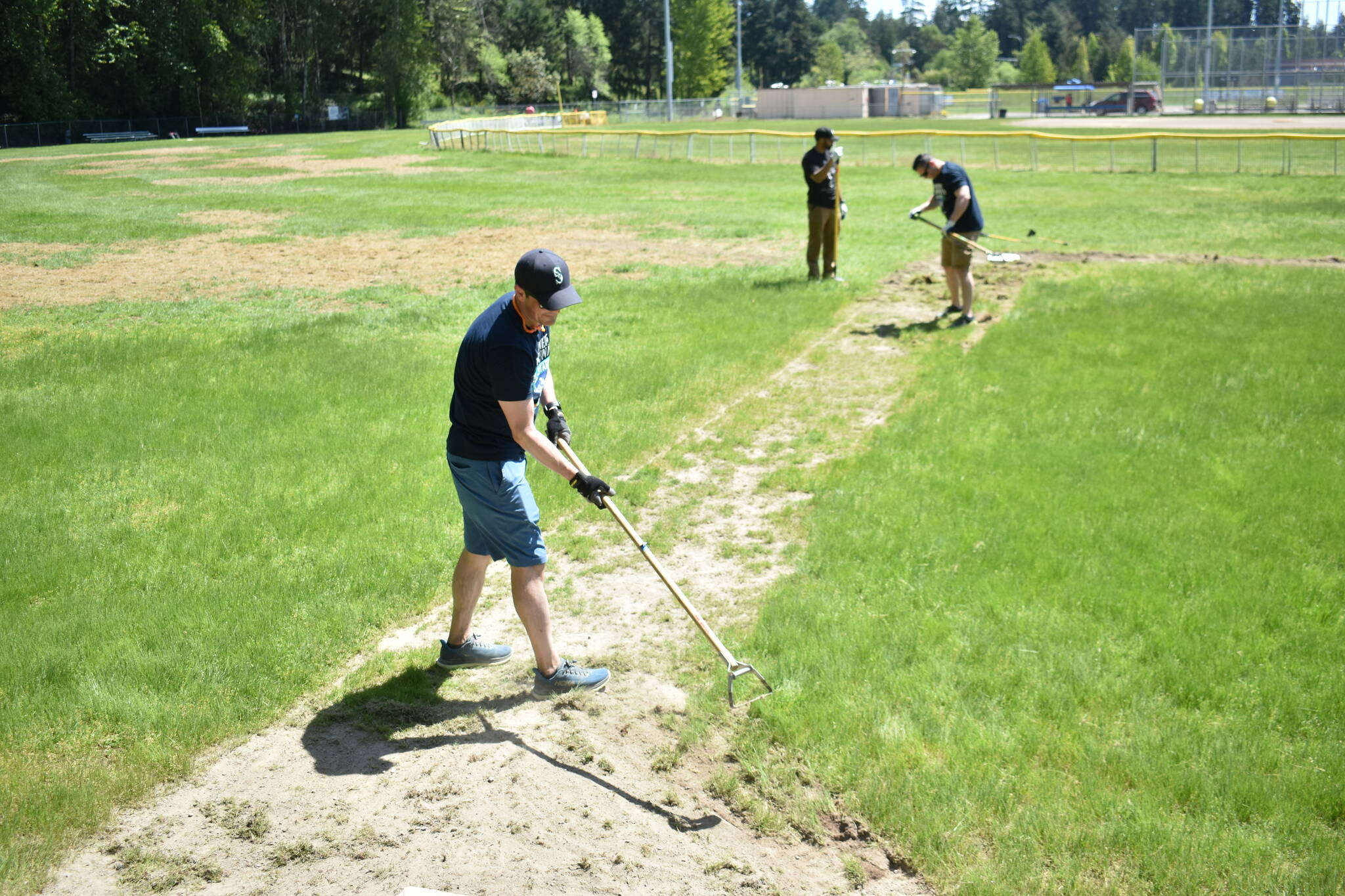 Volunteers helping out on Federal Way National field 4. Ben Ray/ The Mirror