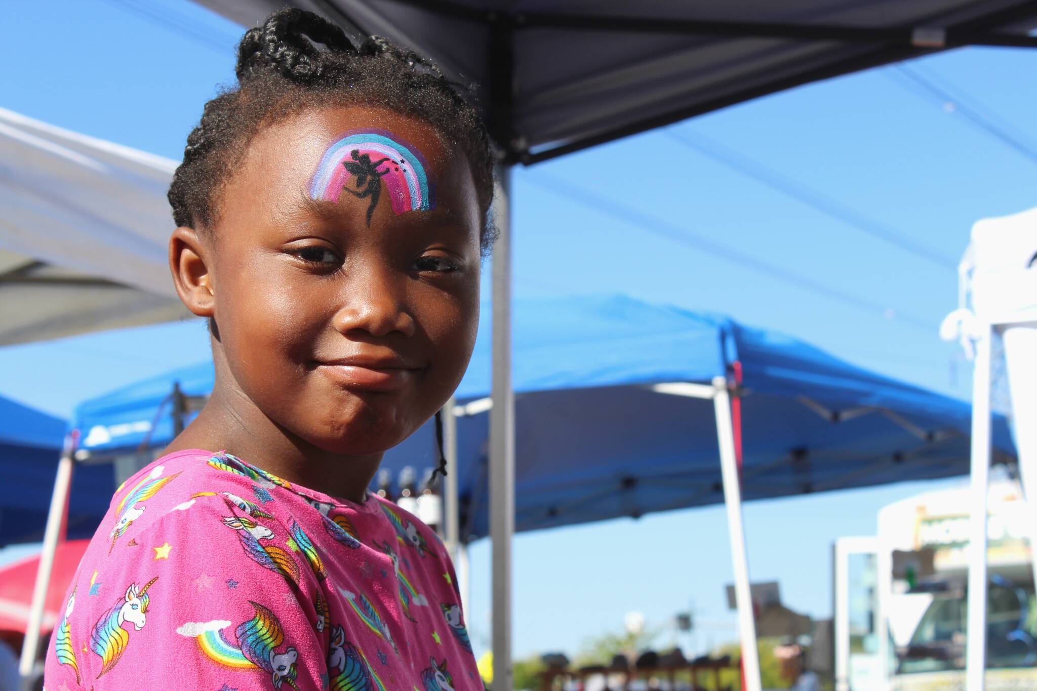 Lealiana McMilion, 6, smiles after visiting a face painter at the Federal Way Farmers Market. Alex Bruell / The Mirror