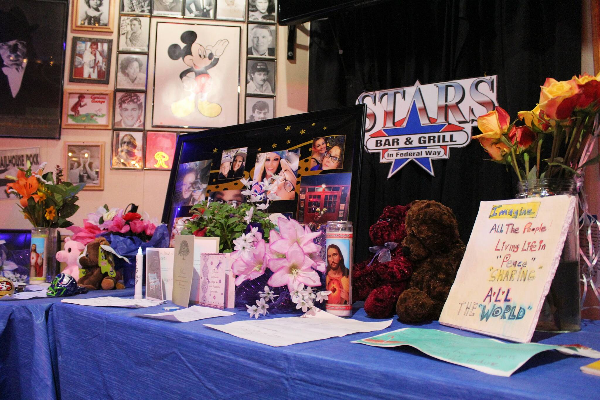A memorial at Stars Bar & Grill includes photos, cards, flowers and trinkets set in reverence of Jessyca Hohn and Katie Duhnke, who were killed just outside the bar May 21. Alex Bruell / The Mirror