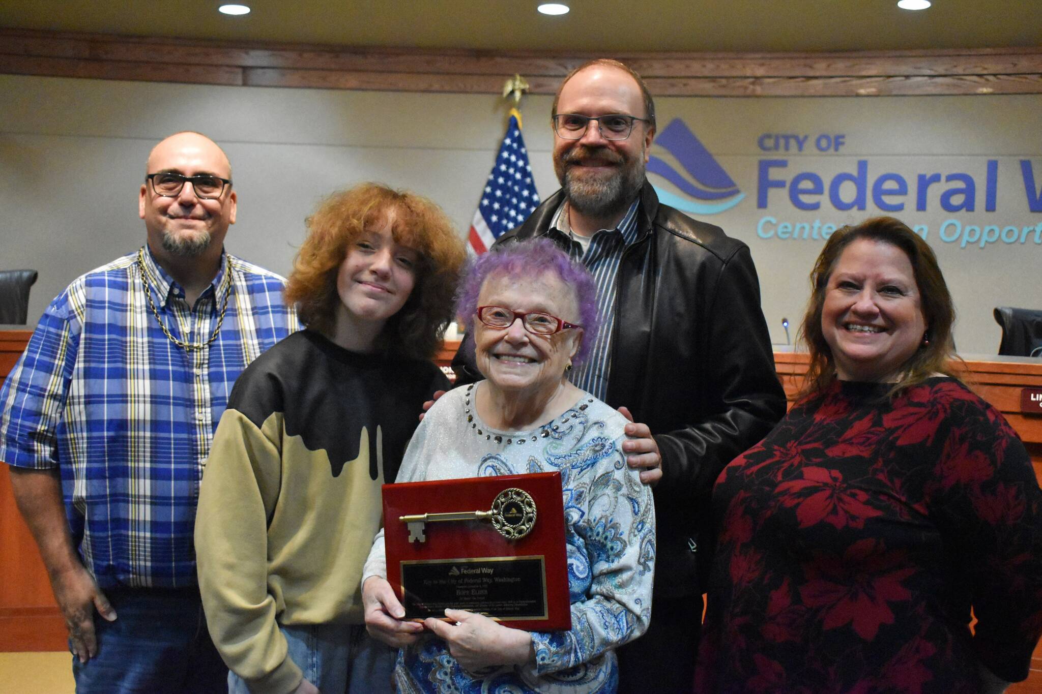 Hope Elder poses for a photo with her family during a December 2022 Federal Way City Council Meeting. Photo by Alex Bruell/the Mirror