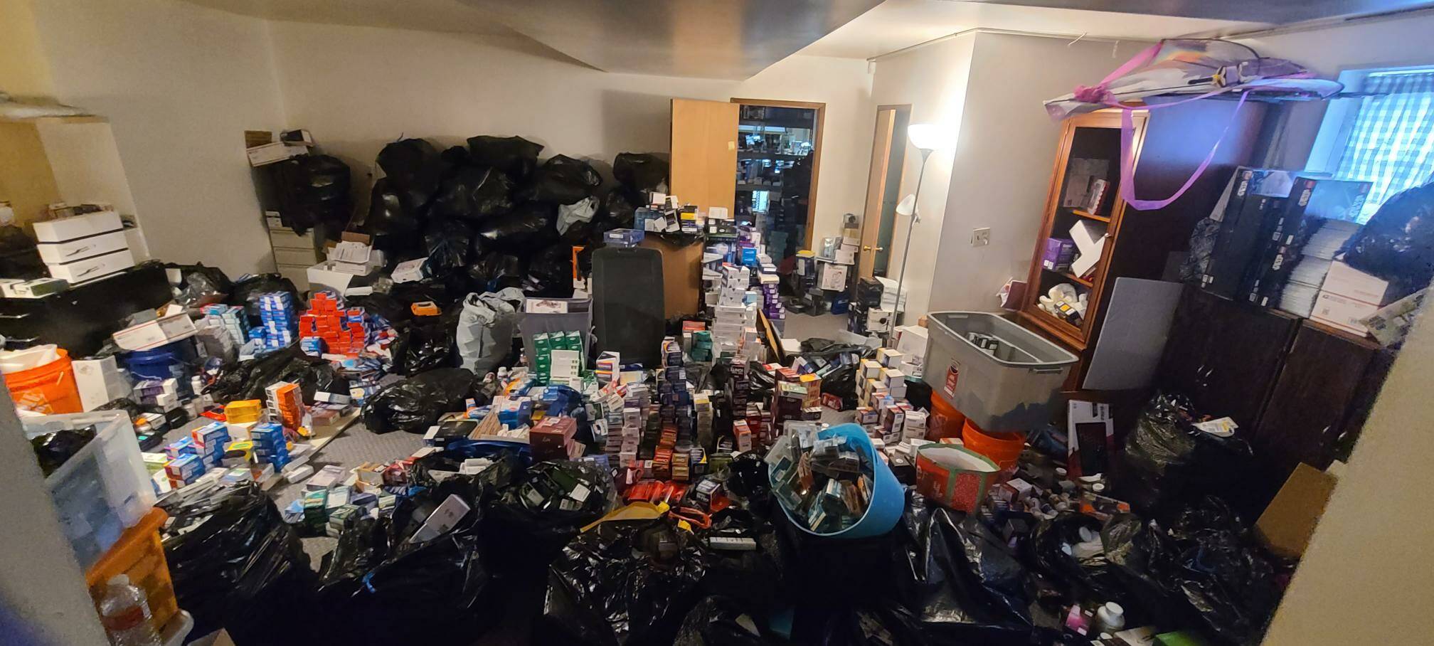 Courtesy of the Renton Police Department
Stolen merchandise piles high at the Federal Way residence of a man suspected of trafficking in stolen merchandise.