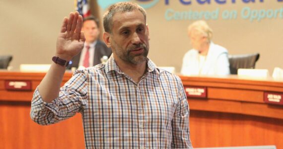 Paul McDaniel takes his oath of office June 26 at the Federal Way City Council chambers. (Photo by Alex Bruell / The Mirror)