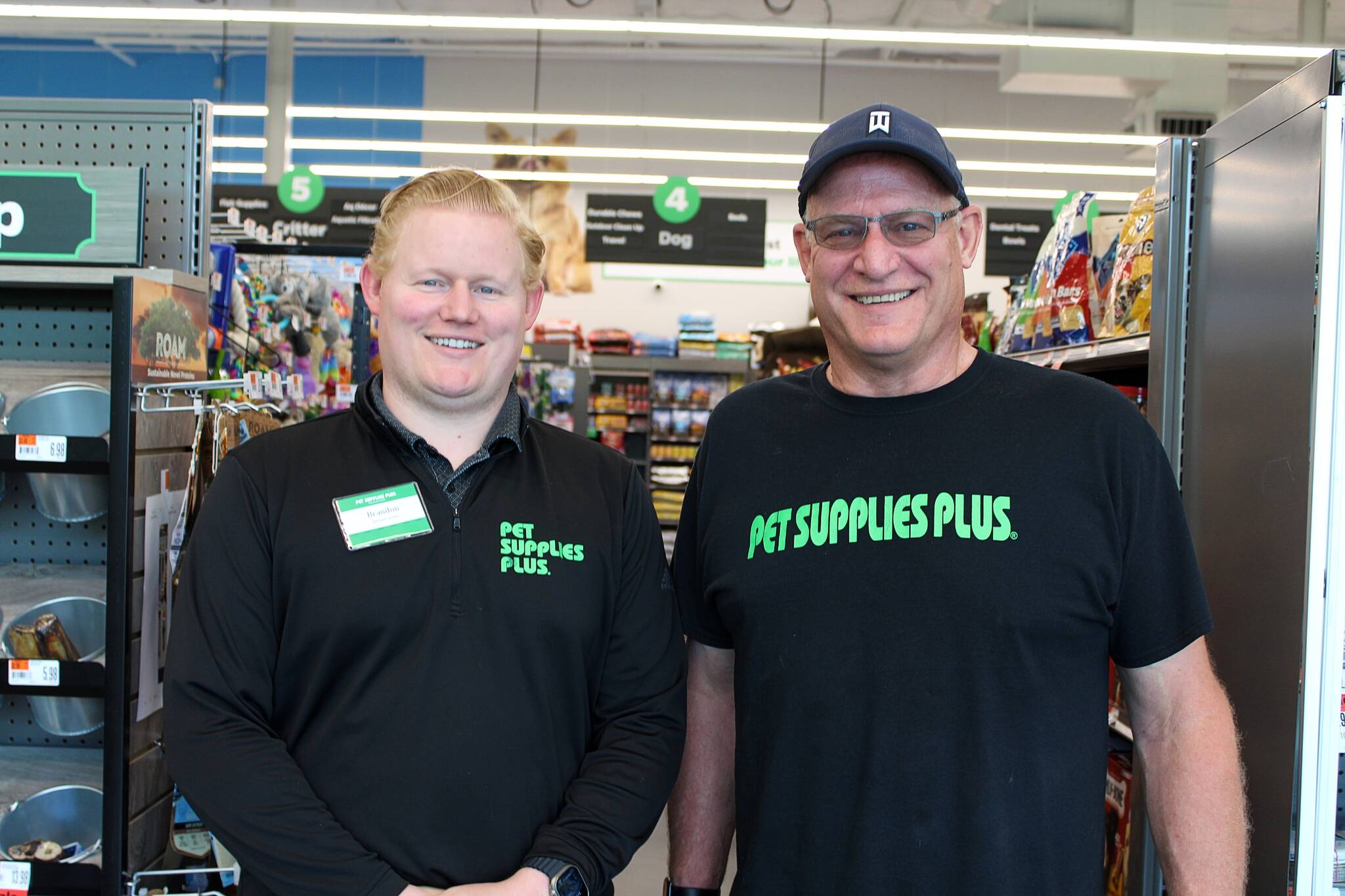 Alex Bruell / The Mirror 
COO Brandon Fischer (left) and owner Bob Fischer are the names behind the store at Federal Way’s new Pet Supplies Plus, located next to and around the corner from Amazon Fresh at The Commons mall.