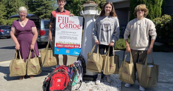Photo by Shelley Pauls / We Love Our City
Volunteers for the Red Canoe school supply drive.