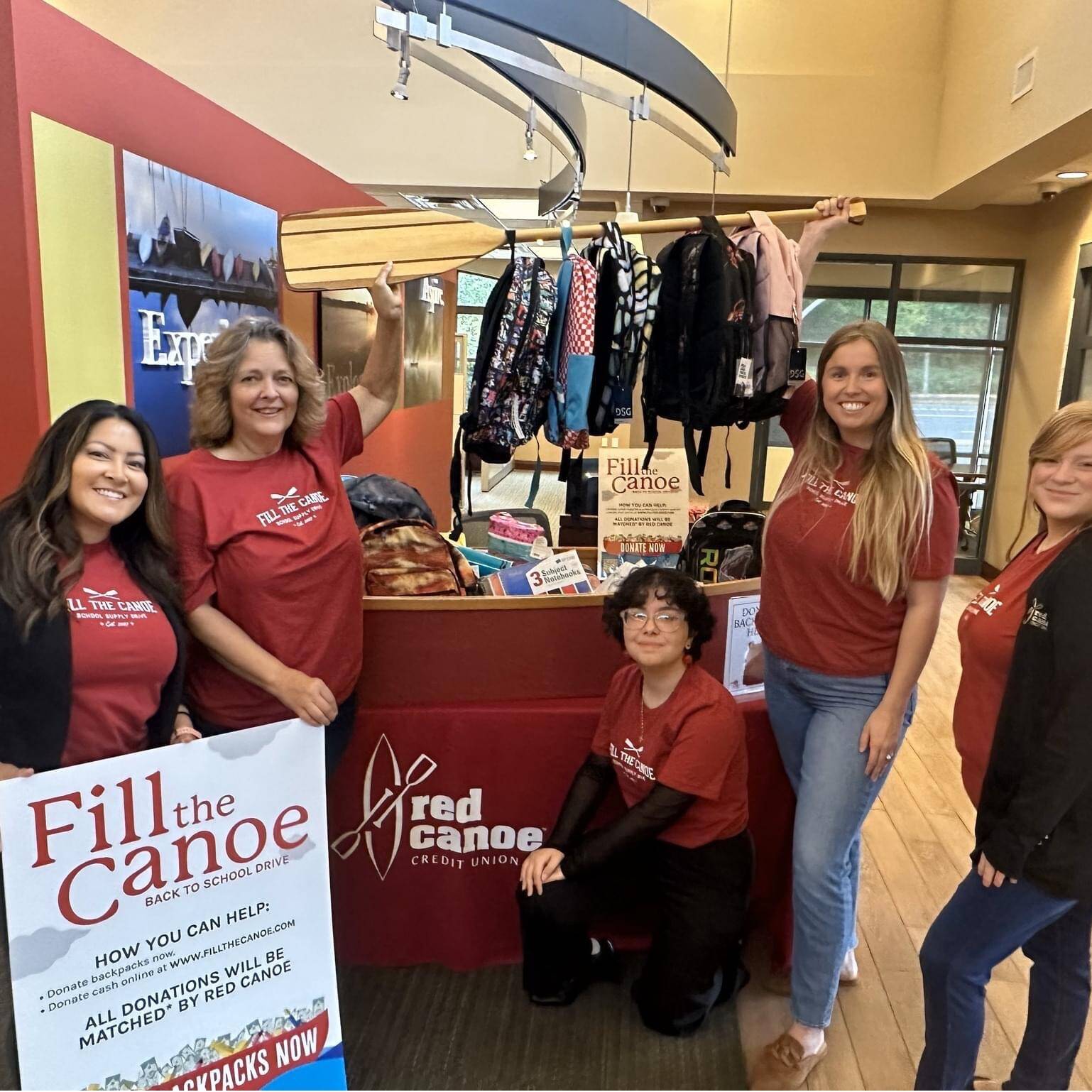 Photo provided by Red Canoe
Federal Way staff of Red Canoe showing their backpack donation to our drive. Employees overall make up one of the largest group of donors.