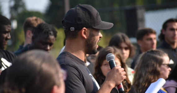 TJHS alumni Lamar Neagle speaks to parents and students at Olympic View. (Ben Ray/The Mirror)