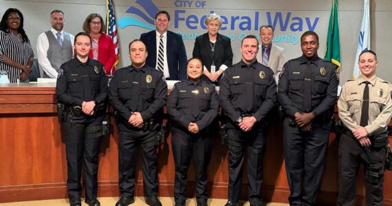 New Federal Way police officers pose with the City Council after being sworn in. Photo provided by the city of Federal Way.