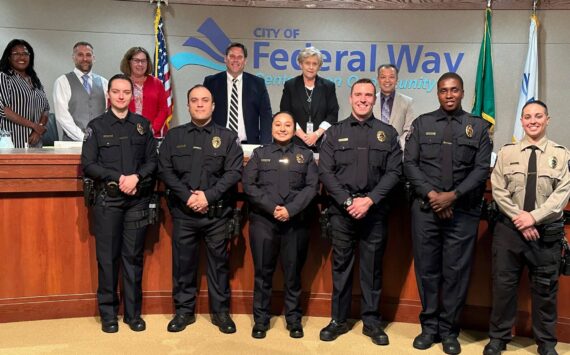 New Federal Way police officers pose with the City Council after being sworn in. Photo provided by the city of Federal Way.