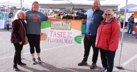 Photo by Keelin Everly-Lang / The Mirror
Ted Colby and Shannon Colby accept the prize for best decorated booth at the Taste of Federal Way for the Saint Vincent De Paul Parish School. Their restaurant partner was Puerto Vallarta Mexican in Twin Lakes.