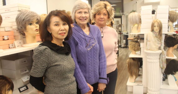 June Paik (left) and her employees at Master Hair Care can work with clients for hours to find the perfect wig or hair piece. Photo by Bailey Jo Josie/Sound Publishing.