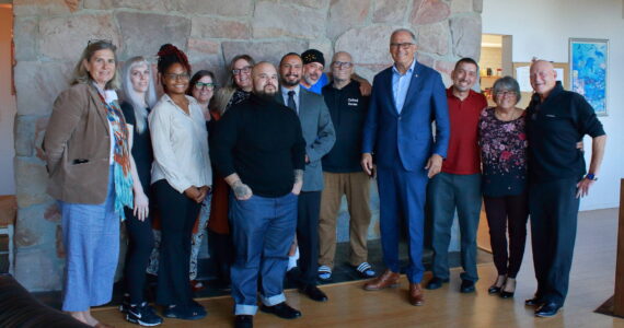 Gov. Jay Inslee poses with local Oxford House chapter representatives, residents and outreach workers along with staff from the Washington Healthcare Authority in Federal Way. Photos by Keelin Everly-Lang / The Mirror