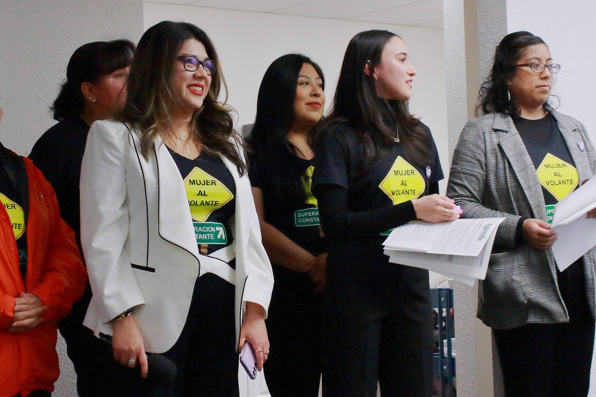 Jacqueline Garcia Castillo and her team at Mujer Al Volante watch Federal Way City Council candidates as the speak to voters at a forum on Wednesday. Photo by Keelin Everly-Lang / The Mirror