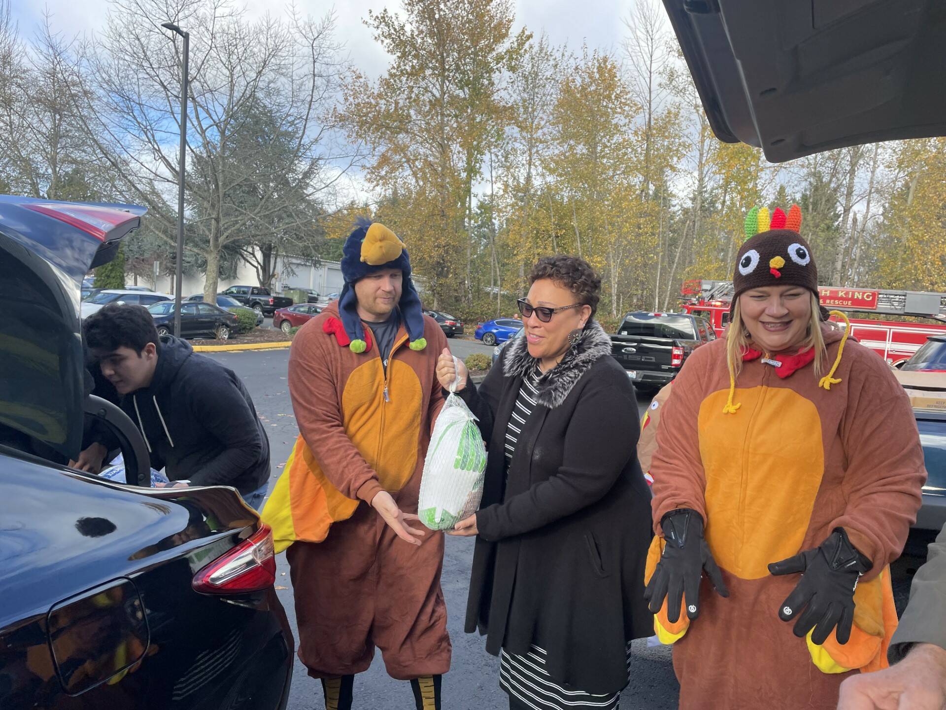 Volunteers got into the holiday spirit by dressing as Thanksgiving turkeys at a turkey donation event on Sunday. (Photo provided by Shelley Pauls)
