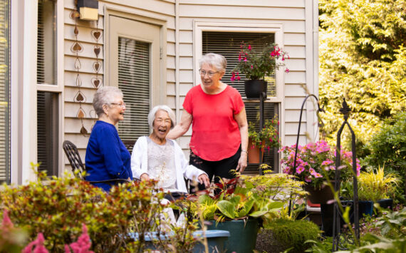 Senior living communities can help alleviate feelings of isolation and loneliness by providing a warm, welcoming environment. Village Green photo