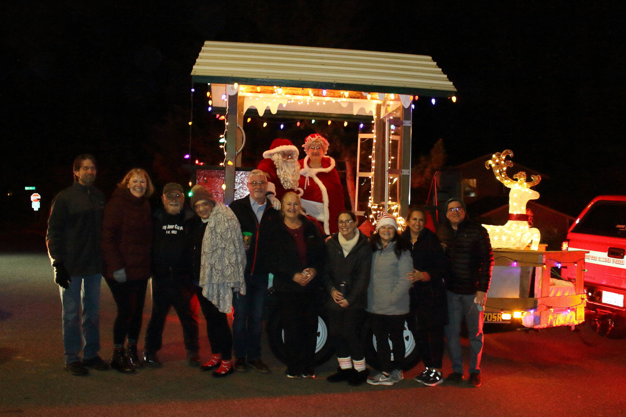 This group of neighbors gathered hundreds of pounds of food donations to hand over during the Santa Parade.