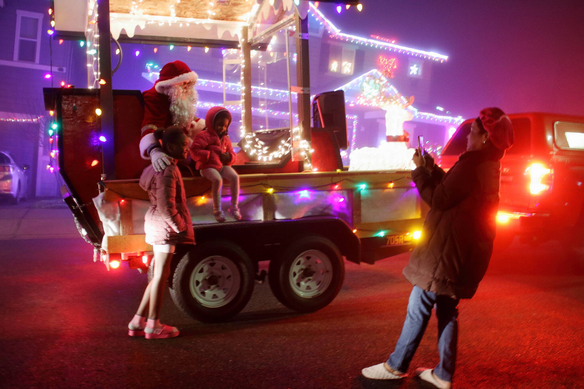 Seeing Santa was a family affair as multiple generations braved the cold and misty night to make holiday memories at the Santa parade. (Photos by Keelin Everly-Lang / The Mirror)