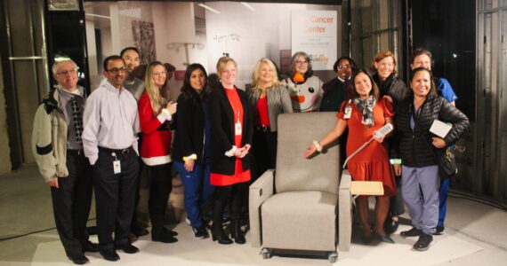 Members of the Valley Medical Oncology department pose with one of the chairs from the Infusion Center. Each chair costs $6,000. Photos by Bailey Jo Josie/Sound Publishing