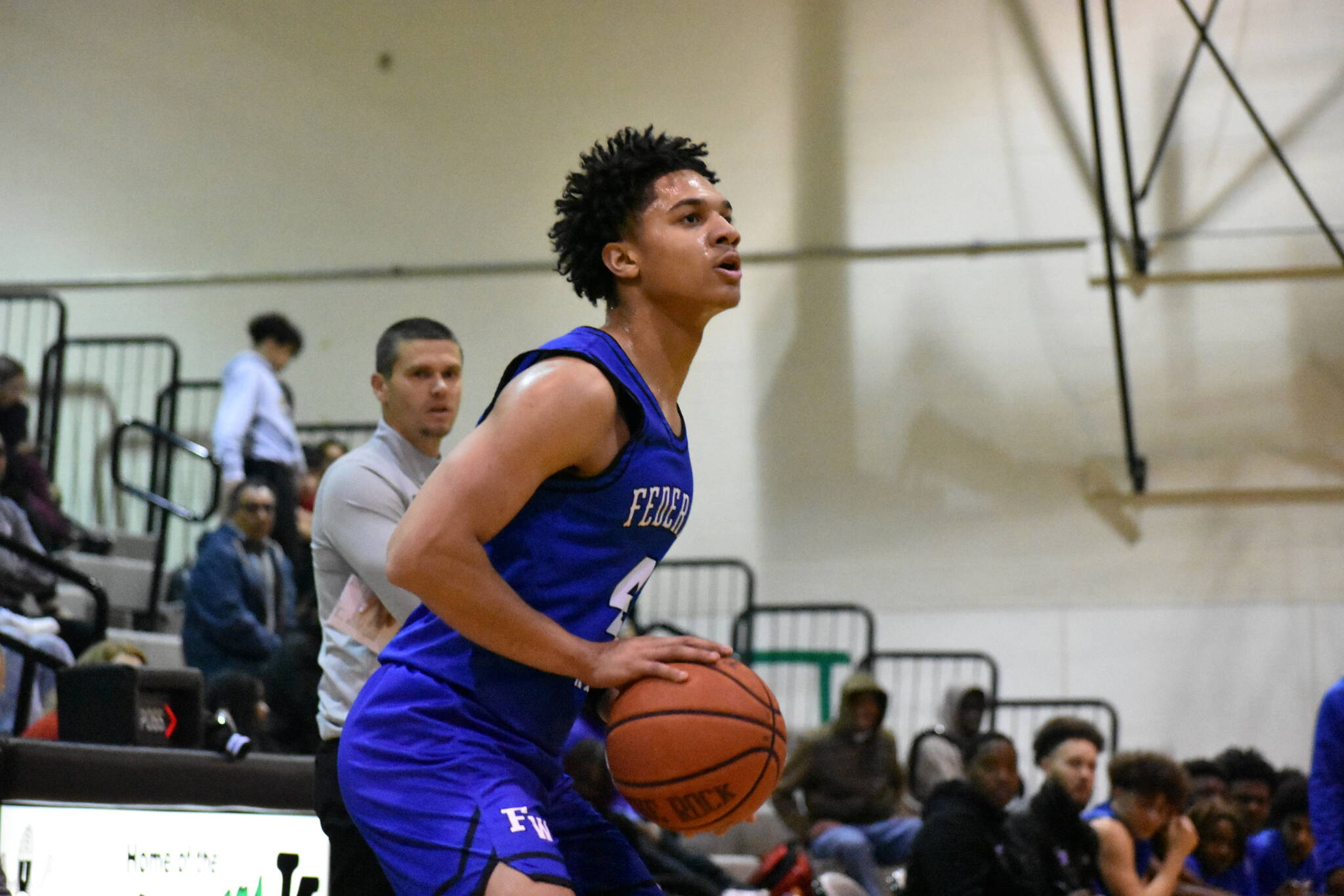 Kofi Peyton lines up a three-point shot. Ben Ray / The Mirror