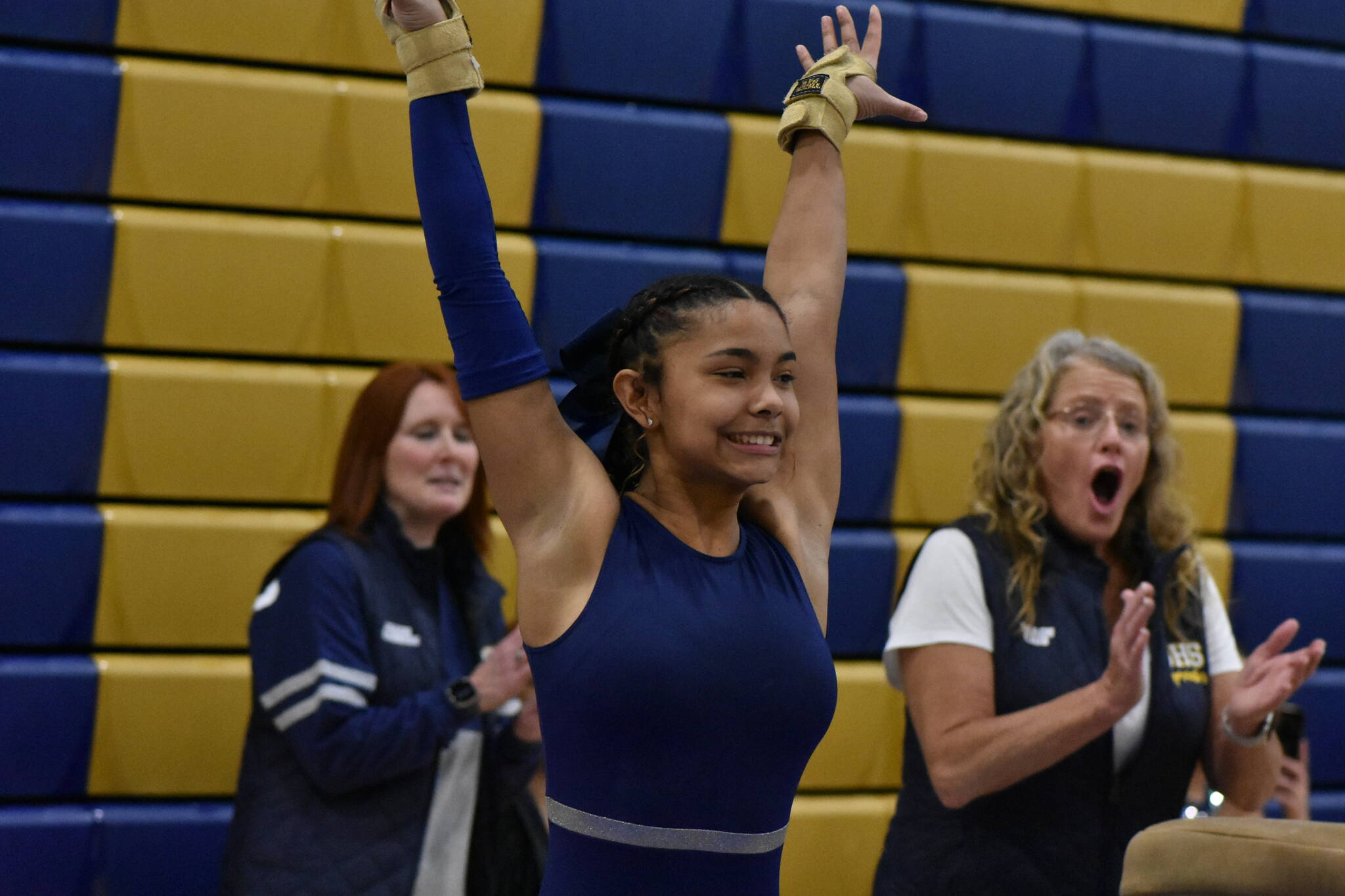 Amyah Johnson from Decatur lands off the vault as coaches celebrate behind her. Ben Ray / The Mirror