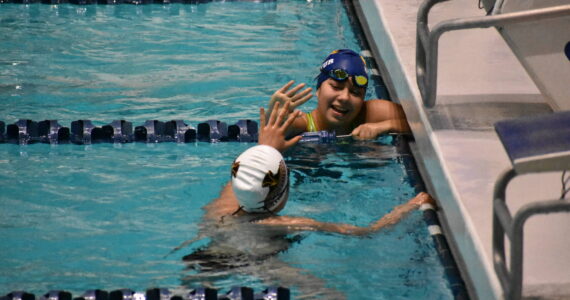 Decatur and Thomas Jefferson swimmers high five after a race at King County Aquatic Center. (Ben Ray / The Mirror)
Decatur and Thomas Jefferson swimmers high five after a race at King County Aquatic Center. Ben Ray / The Mirror