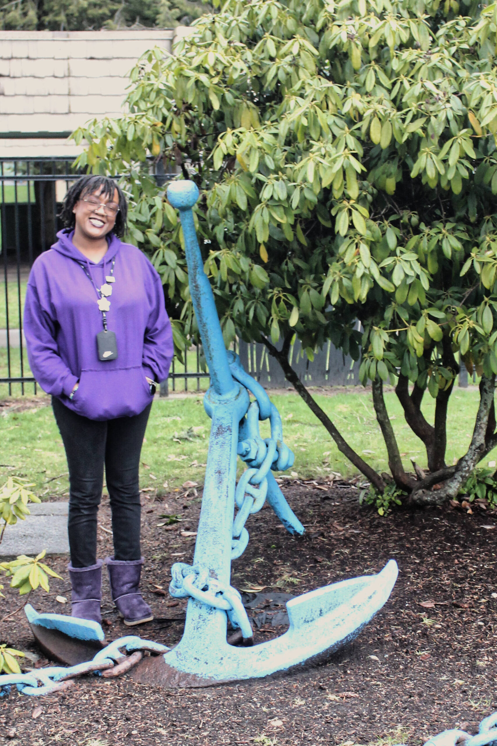 Danielle McFarlane poses with the Twin Lakes anchor in front of the elementary school. The anchor represents their school mascot. (Photo by Keelin Everly-Lang / The Mirror)