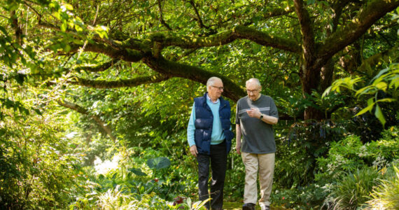 Walking promotes physical health, but it also provides a tranquil setting for social interactions among friends. Photo courtesy Village Green