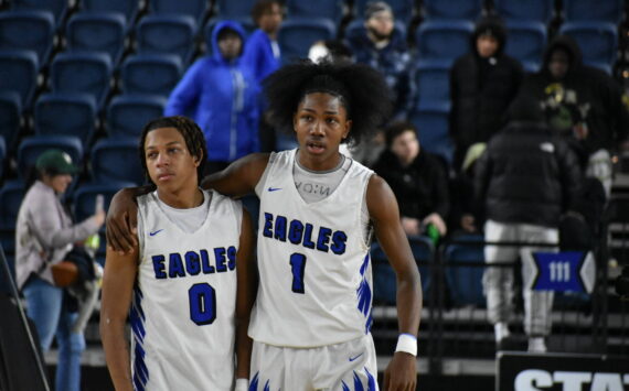 Candon Bible and Geron White walk back to the Federal Way bench after falling to Skyview. (Ben Ray / The Mirror)