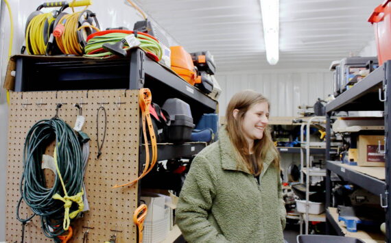 Amanda Miller at the South King Tool Library in Federal Way as she looks for a tool for a visitor. Photo by Keelin Everly-Lang / The Mirror