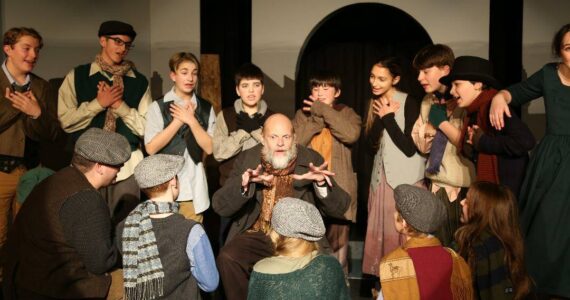 Lee Howard as Fagin surrounded by the youth in our 2019 production of “Oliver!” Photo provided by St Luke’s.