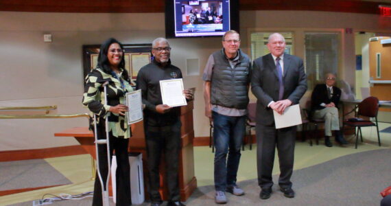 Leaders of the financial literacy classes pose while receiving their proclamation at the council meeting. Photo by Keelin Everly-Lang / The Mirror